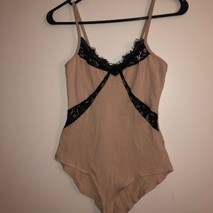 Nude and black lace body suit